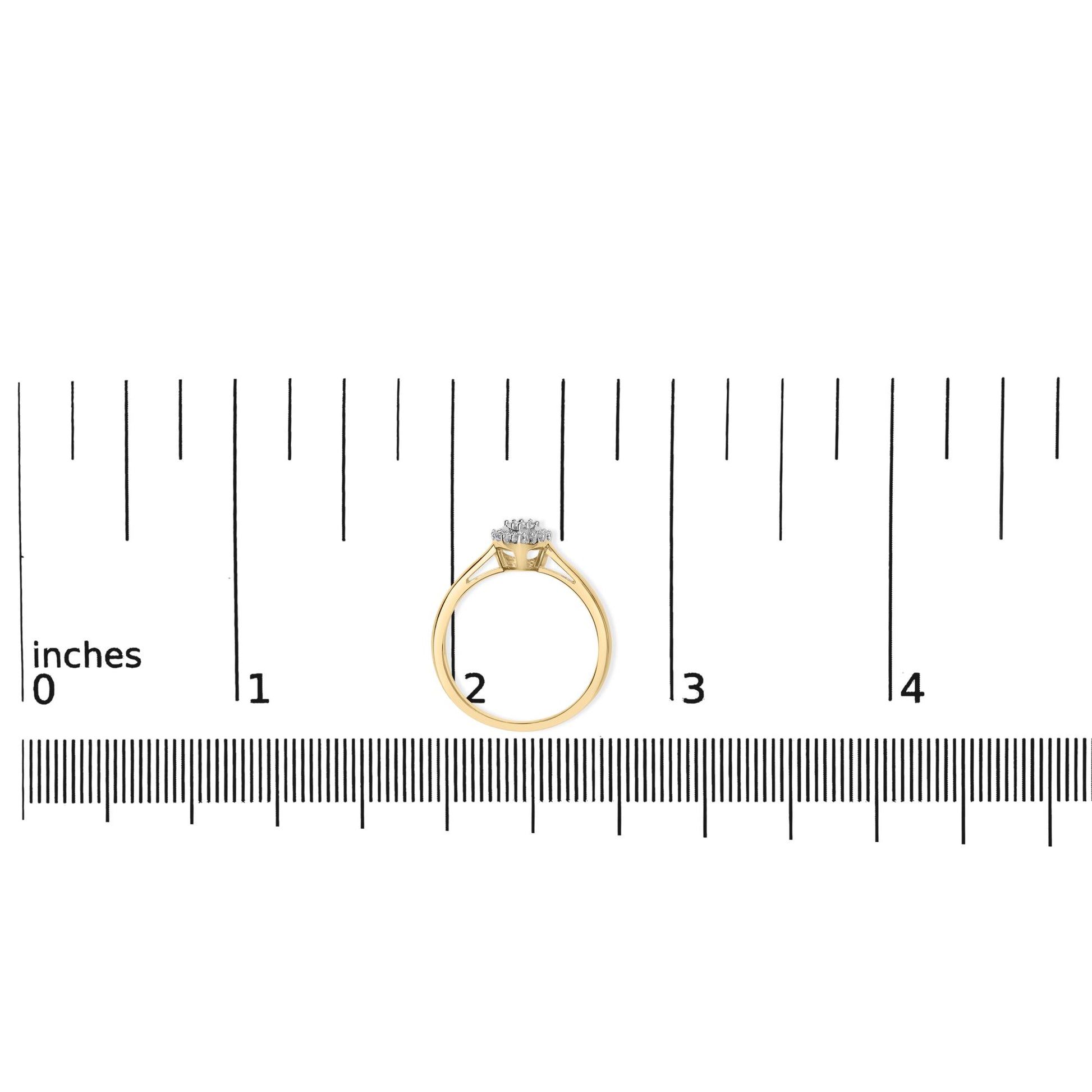 Yellow and white metal ring with round white gemstones in prong settings, shown from the side on a ruler for size reference.