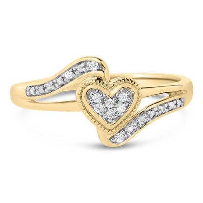 Front-facing view of a yellow and white metal ring featuring a heart-shaped centerpiece paved with small white gemstones, flanked by two curved bands also set with small white gemstones.