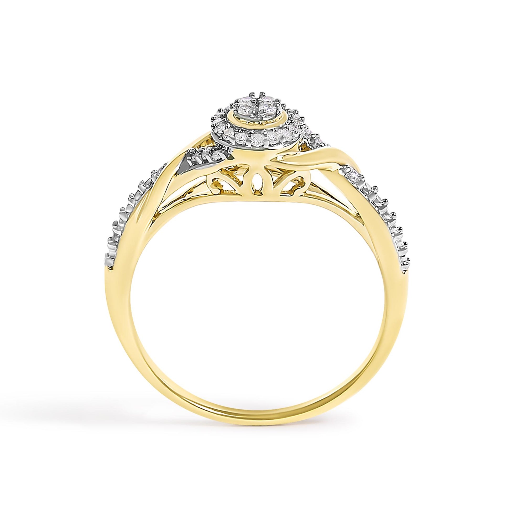 Yellow metal ring with an intricate split shank design, adorned with multiple round white gemstones in prong settings, shown from the side angle.