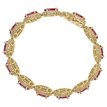 Top-down view of a yellow metal bracelet featuring alternating oval red gemstones and round white gemstones in four-prong settings.