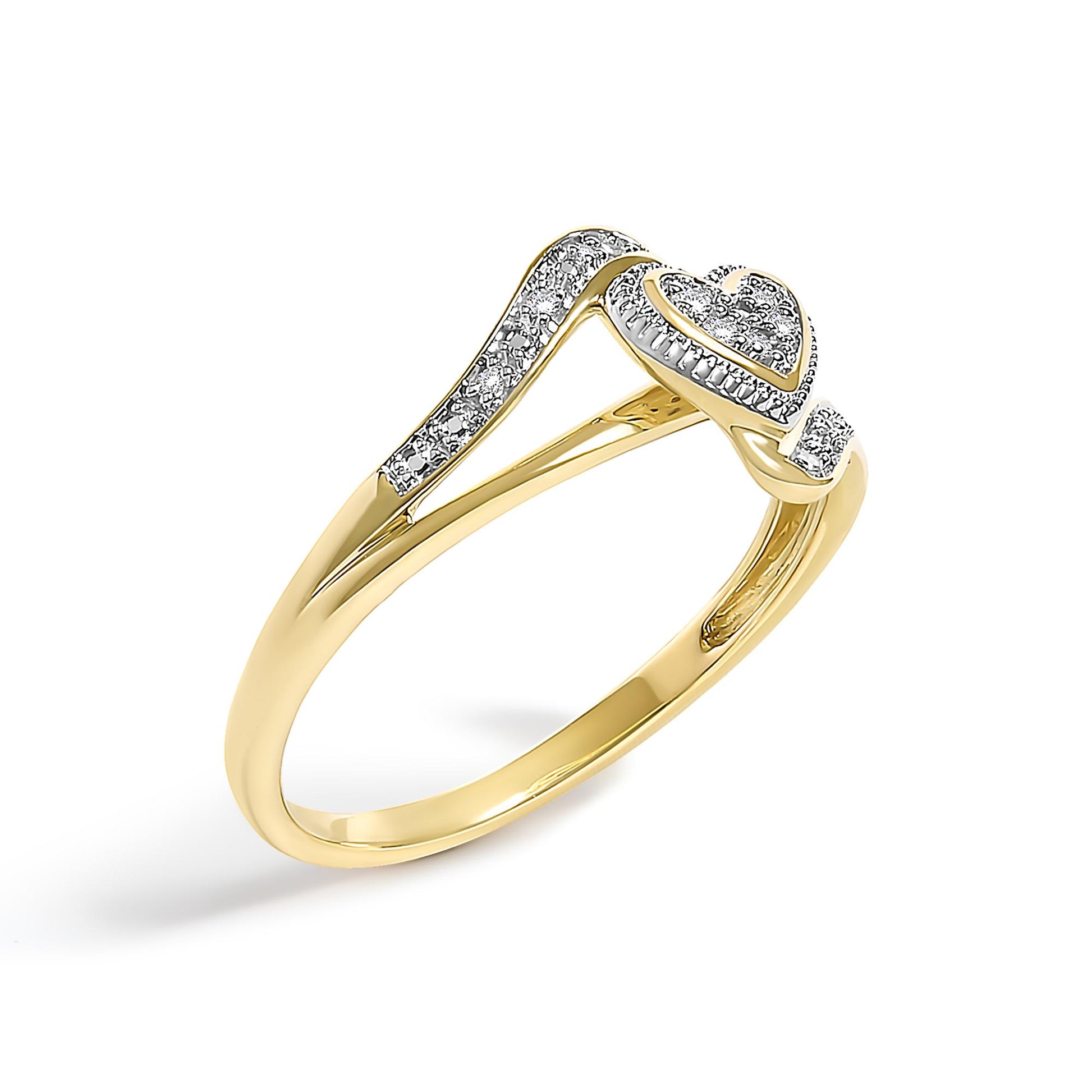 Yellow ring with a split shank design, featuring multiple white round gemstones in pave setting along the band and a heart-shaped cluster of white gemstones, shown at a three-quarter angle.