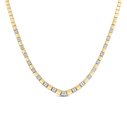 Yellow metal necklace with alternating square links and white gemstones in 4-prong settings, shown from a front angle.
