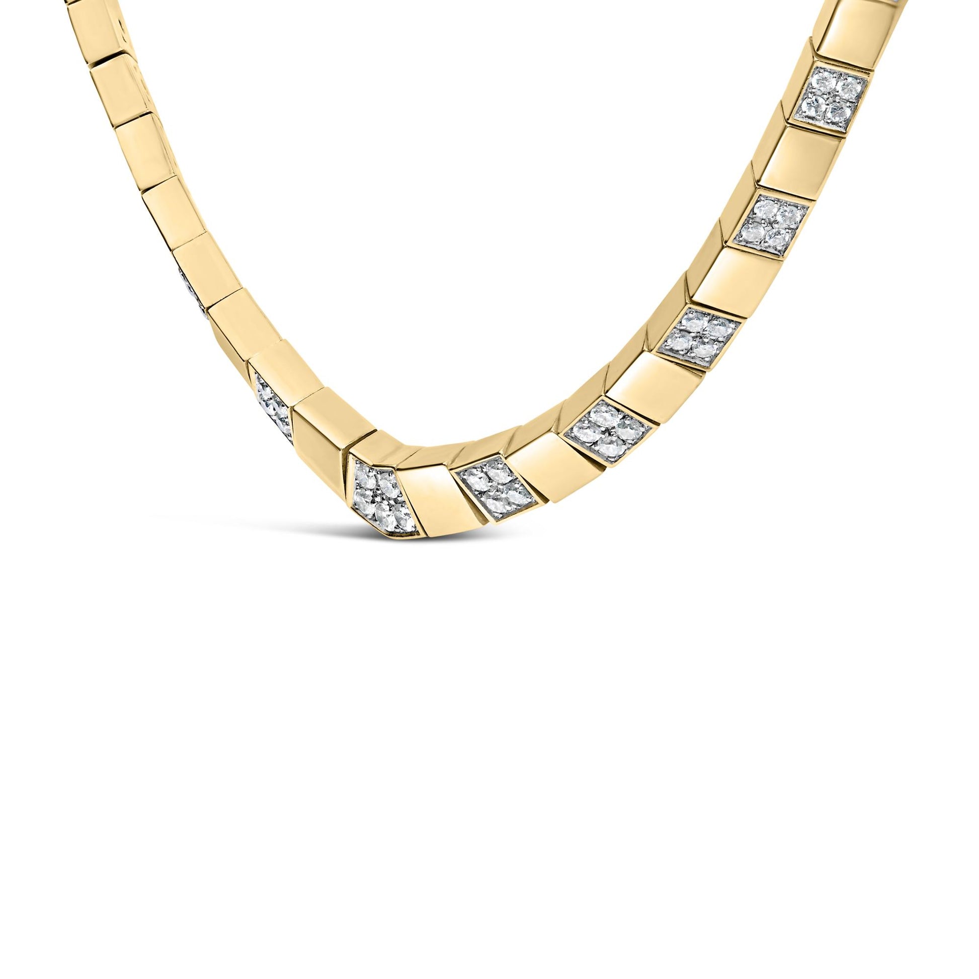 Close-up front view of a yellow metal necklace with square links, some inset with clusters of round white gemstones in 4-prong settings.