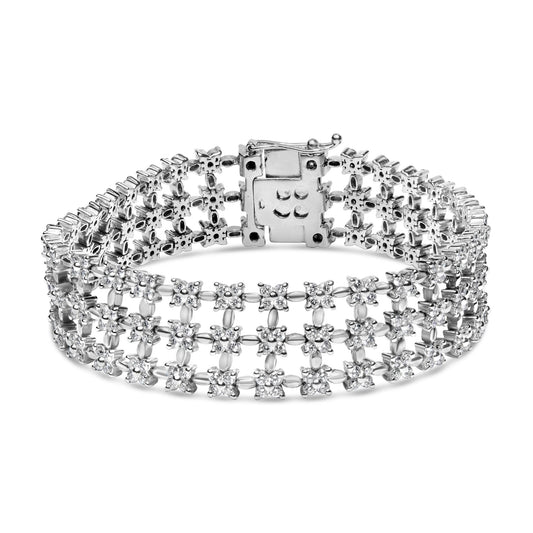 White metal bracelet with three rows of linked clusters of round white gemstones in 4-prong settings, shown from a front angled view.