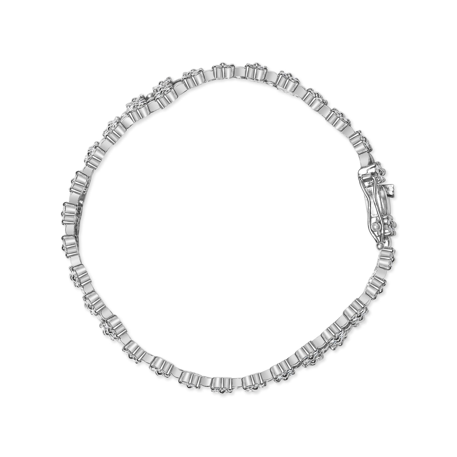 Top-down view of white metal bracelet with round white gemstones in 4-prong settings all around.