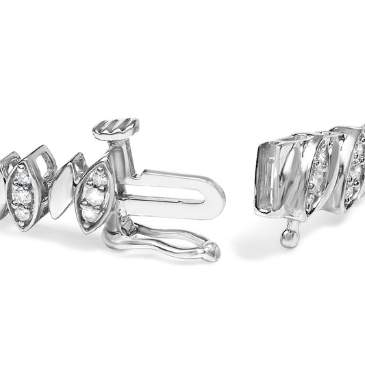 Close-up front angle of a white bracelet with marquise-shaped links, each set with round white gemstones in a pave setting, featuring a clasp mechanism.