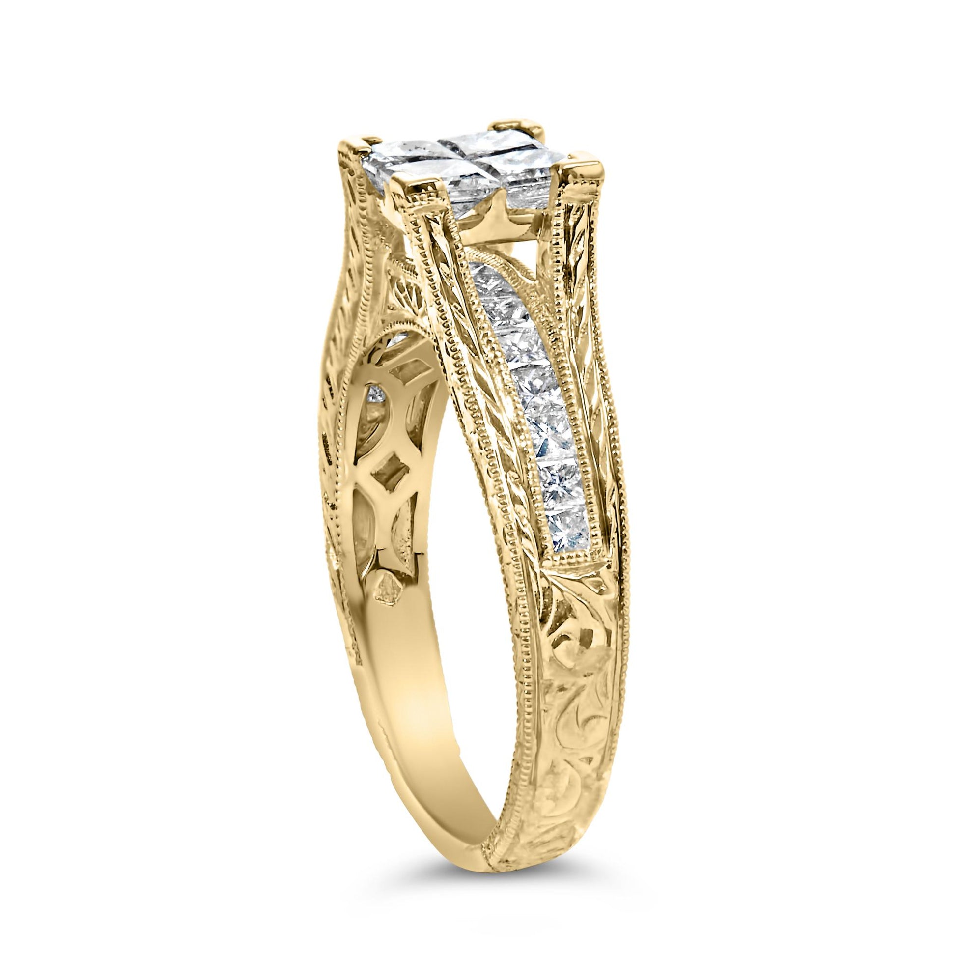 Yellow metal ring with intricate engravings, featuring a top cluster of four princess-shaped white gemstones in an invisible setting, and a channel of princess-shaped white gemstones along the band; shown at a slight angle.