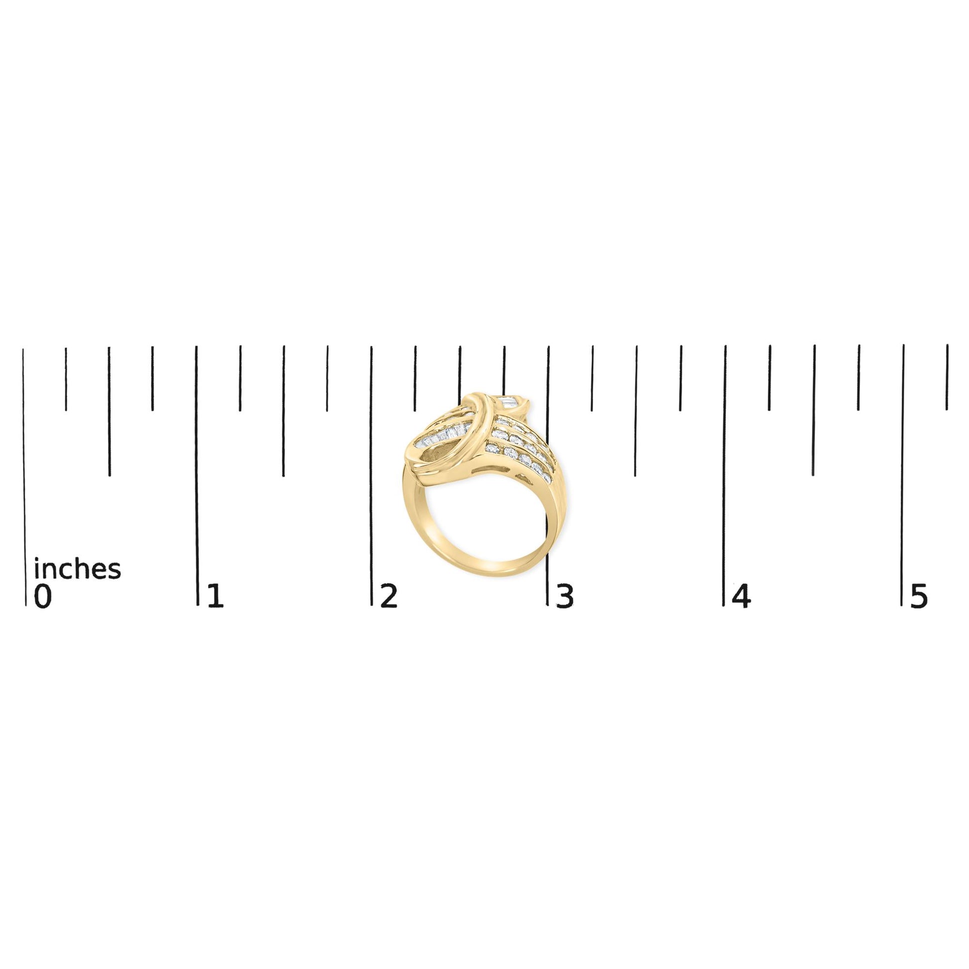 Yellow metal ring with two rows of channel-set white round gemstones and one row of channel-set white baguette gemstones, shown on top of a ruler, angled slightly from above.