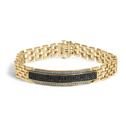 Yellow metal bracelet with a wide link chain and a rectangular central bar adorned with black and white round gemstones in pave setting, shown from a front angle on a white background.
