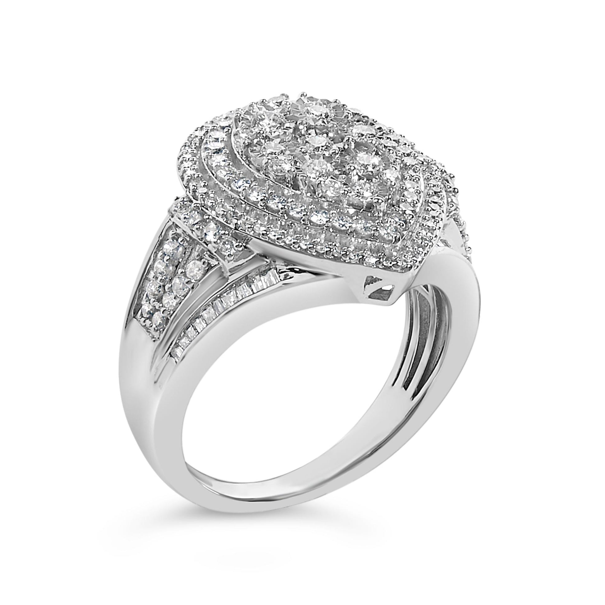 White metal ring with a pear-shaped cluster of round white gemstones on top surrounded by concentric rows of smaller round gemstones, and bands of round and baguette white gemstones on the shoulders, shown from a front angled view.