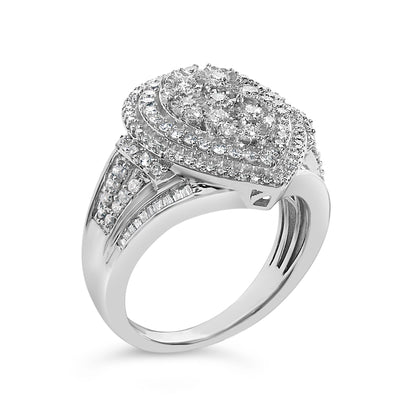 White metal ring with a pear-shaped cluster of round white gemstones on top surrounded by concentric rows of smaller round gemstones, and bands of round and baguette white gemstones on the shoulders, shown from a front angled view.