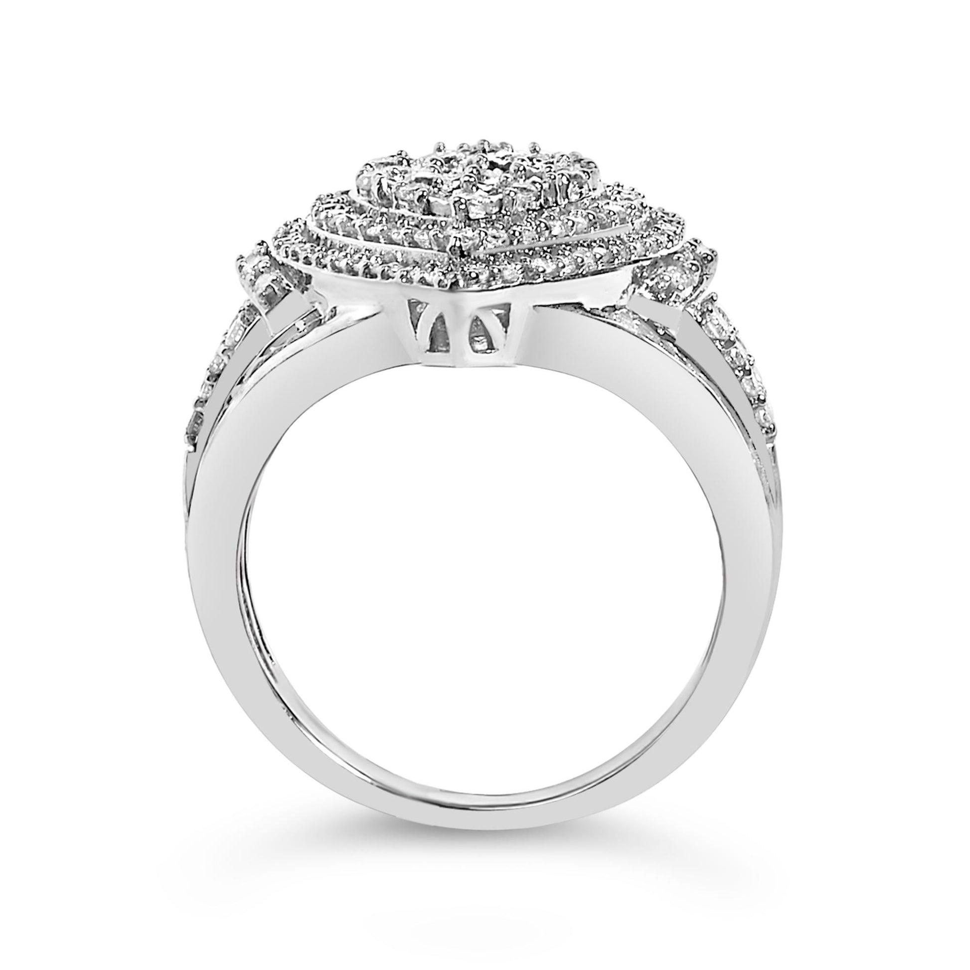 White metal ring shown from the side angle with a square-shaped cluster of white round gemstones in prong setting and white baguette gemstones in channel setting around the band.