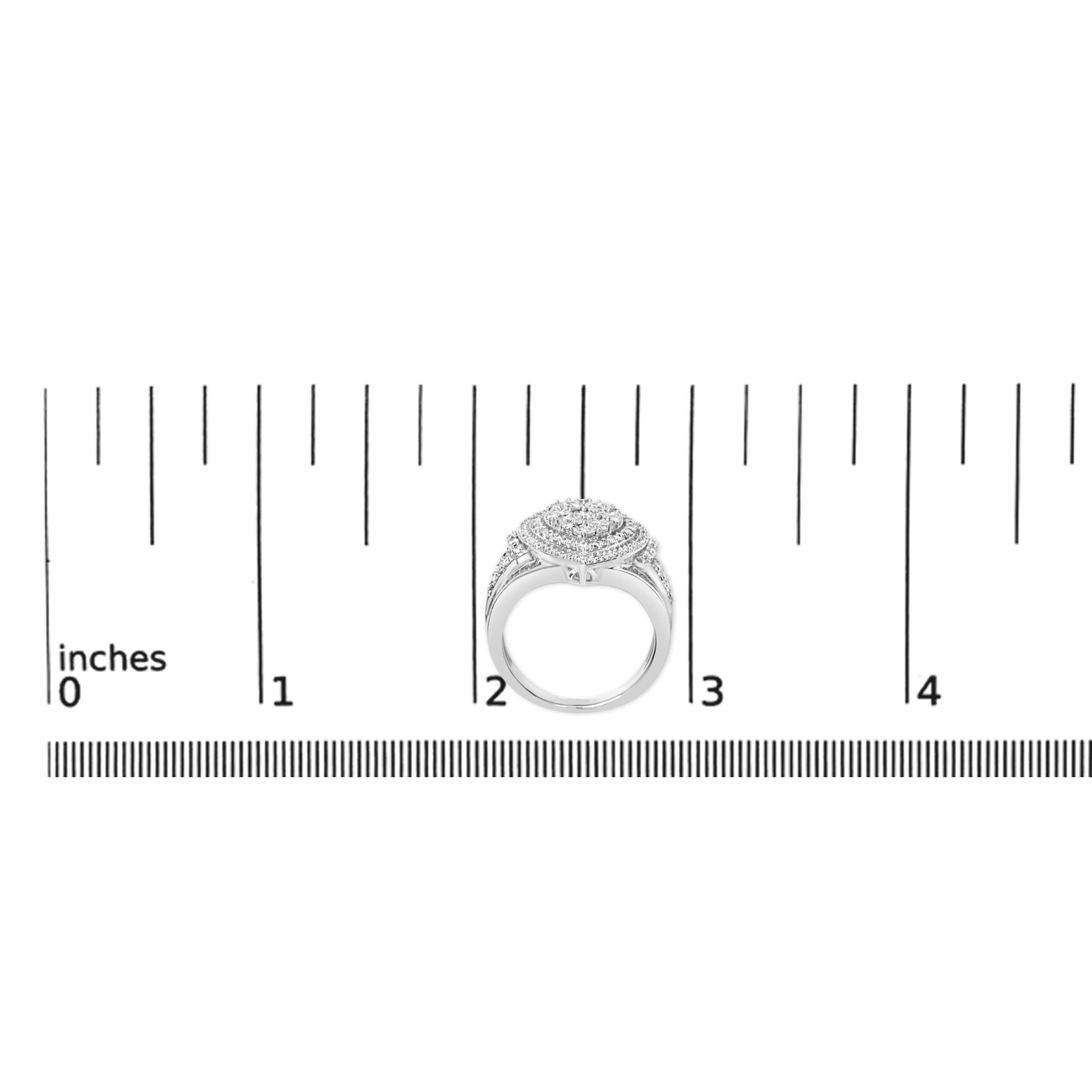 White metal ring with a round cluster of white gemstones on top, featuring channel-set baguette-shaped gemstones and prong-set round gemstones along the band, shown on a scale from a top front angle.