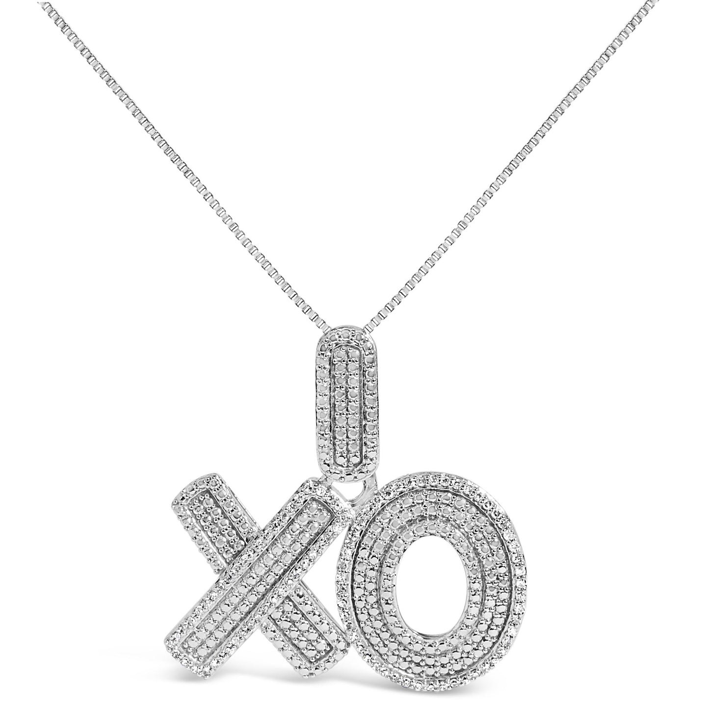 Front view of white necklace pendant shaped as X and O letters, both covered with round white gemstones in prong settings, suspended from a box chain.
