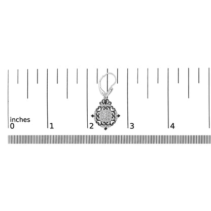 Earring with white and black metal featuring a square cluster of white gemstones in invisible setting surrounded by ornate black metal scrollwork accented with small round white and black gemstones, shown on a scale from a top front angle.