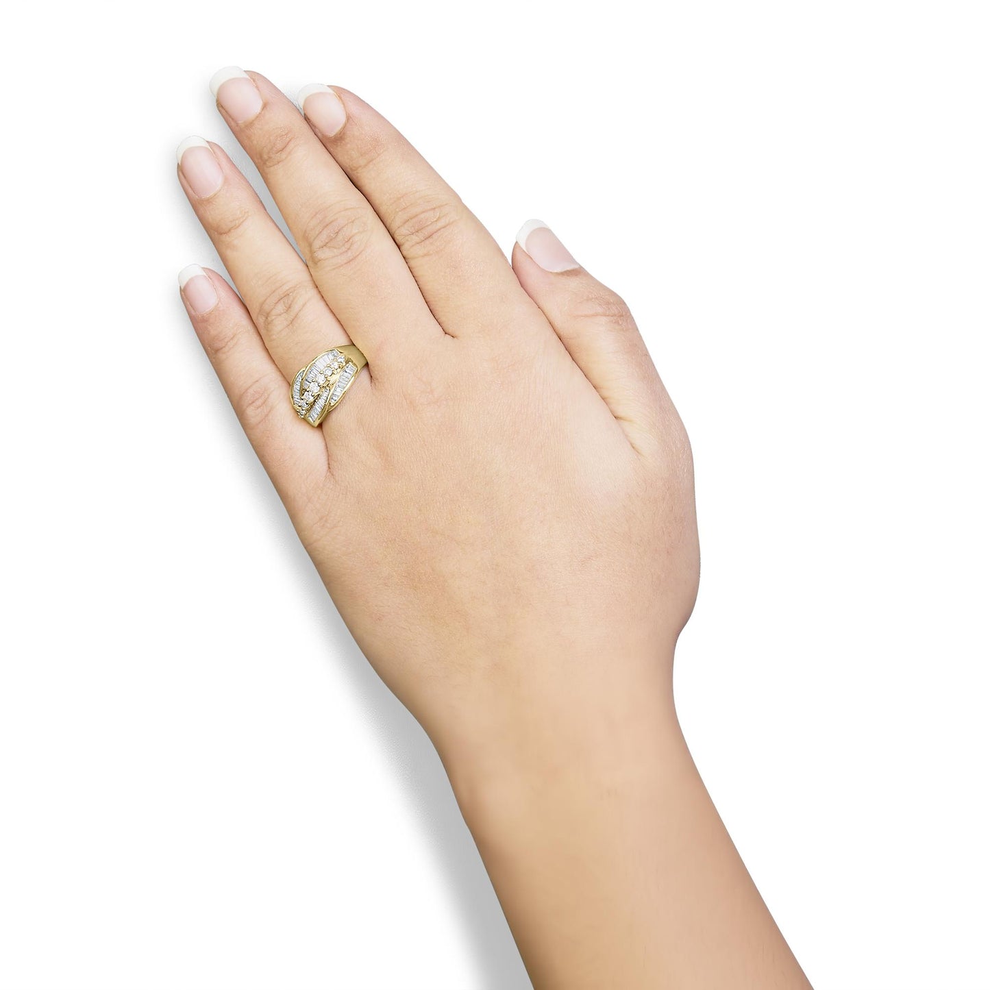 Hand wearing a yellow metal ring with white round gemstones in shared prong setting and white baguette gemstones in channel setting, shown from above at an angle.