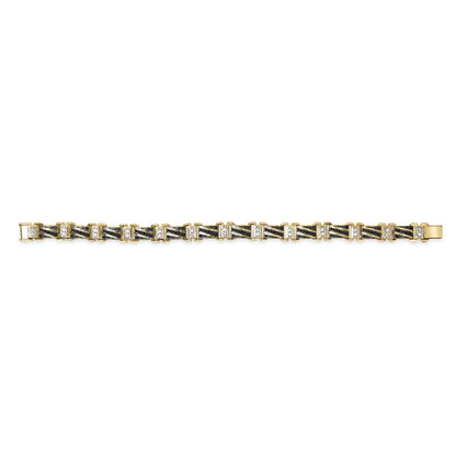 Bracelet in yellow, white, and black metal with alternating black and white round gemstones, shown in a top-down flat lay angle on a white background.