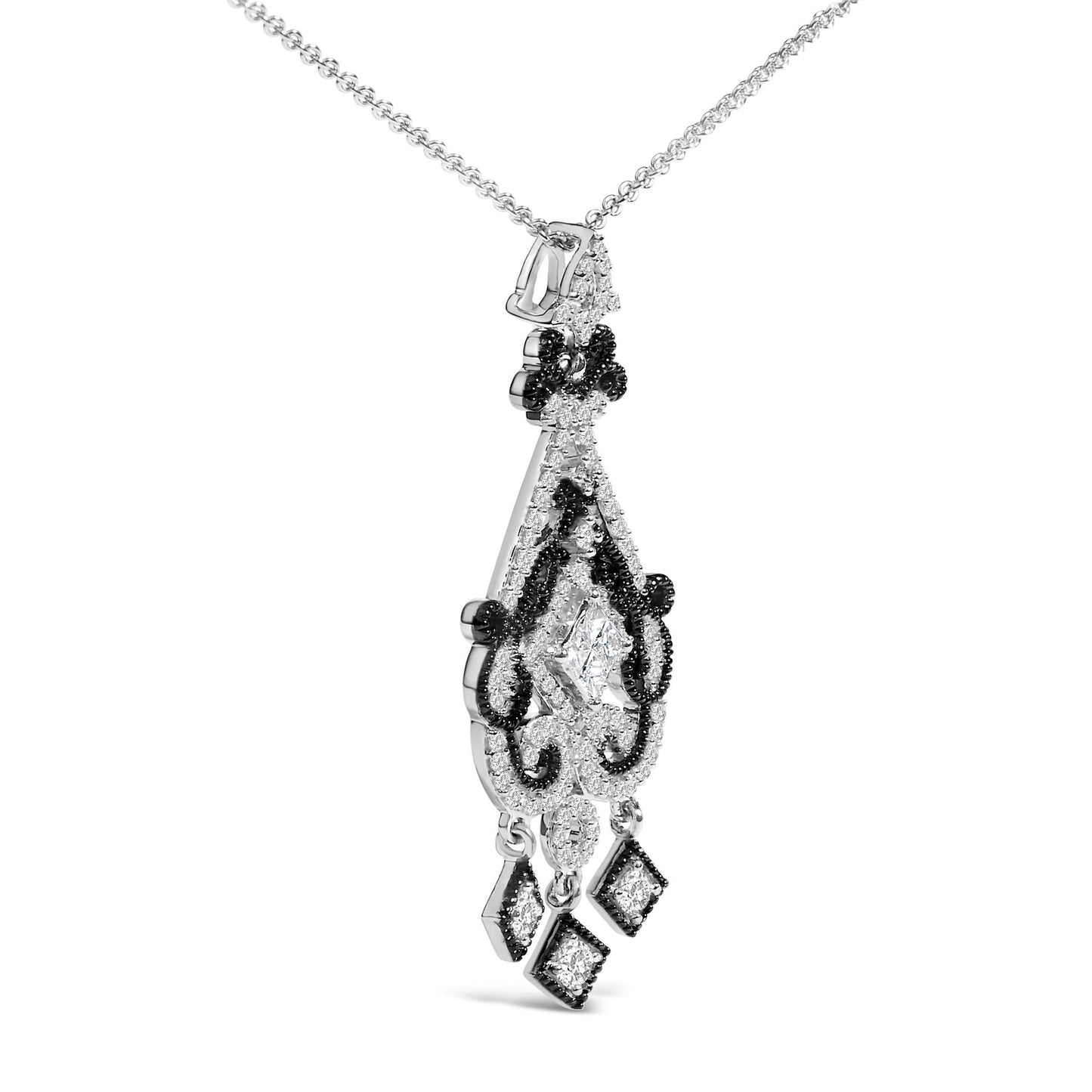 Necklace shown in a close-up angled shot with a white and black metal pendant featuring a mix of round and princess-shaped white gemstones, including three hanging diamond-shaped elements.
