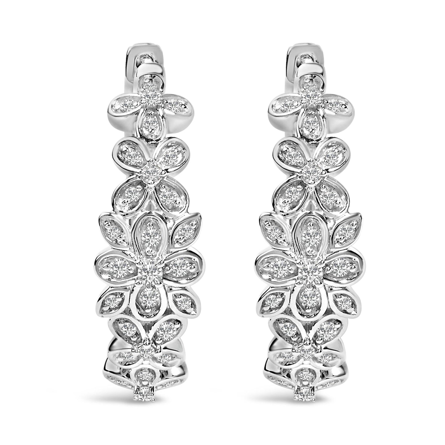 Front view of white metal earrings designed with multiple floral shapes set with round white gemstones in pave setting.