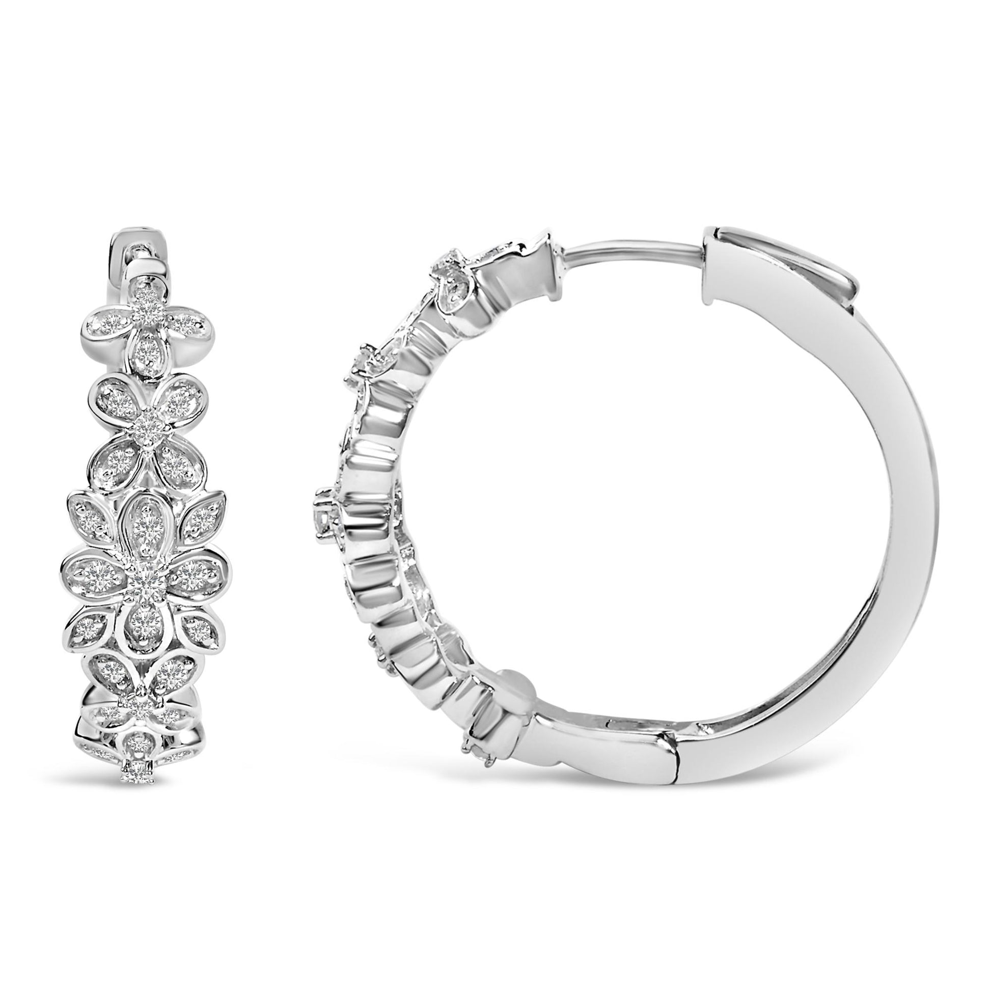 Close-up front and side views of white metal hoop earrings with floral designs featuring round white gemstones in pave setting.
