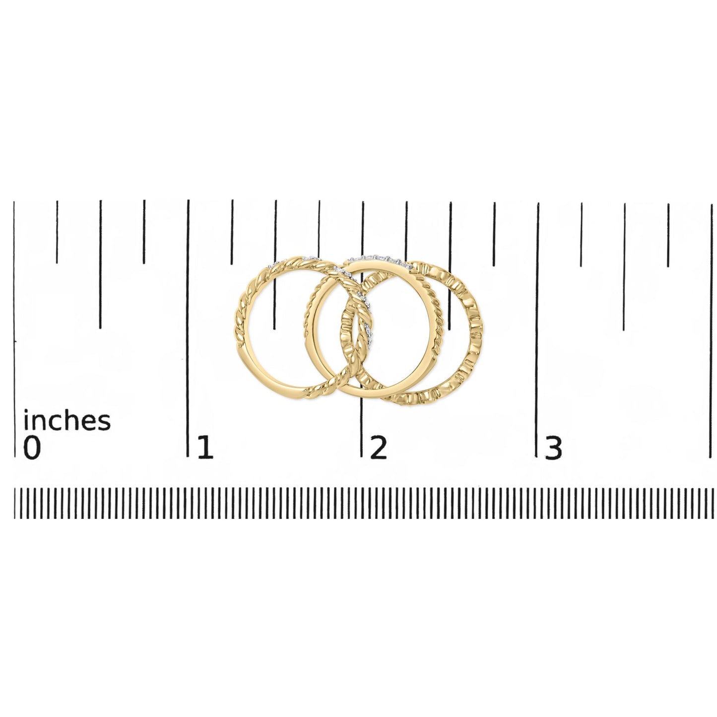 Three yellow and white metal rings, one with round white gemstones in pave setting, shown on a ruler scale from a top flat angle.