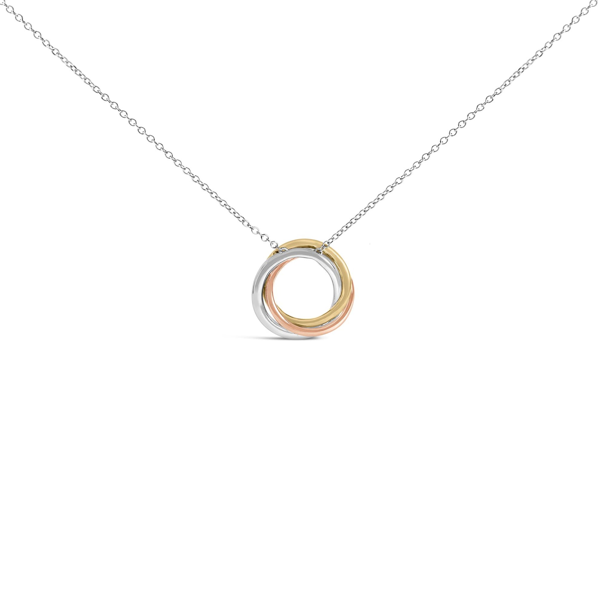 Close-up front view of a necklace with interlocking circular pendants in white, yellow, and rose tones, shown on a white chain.