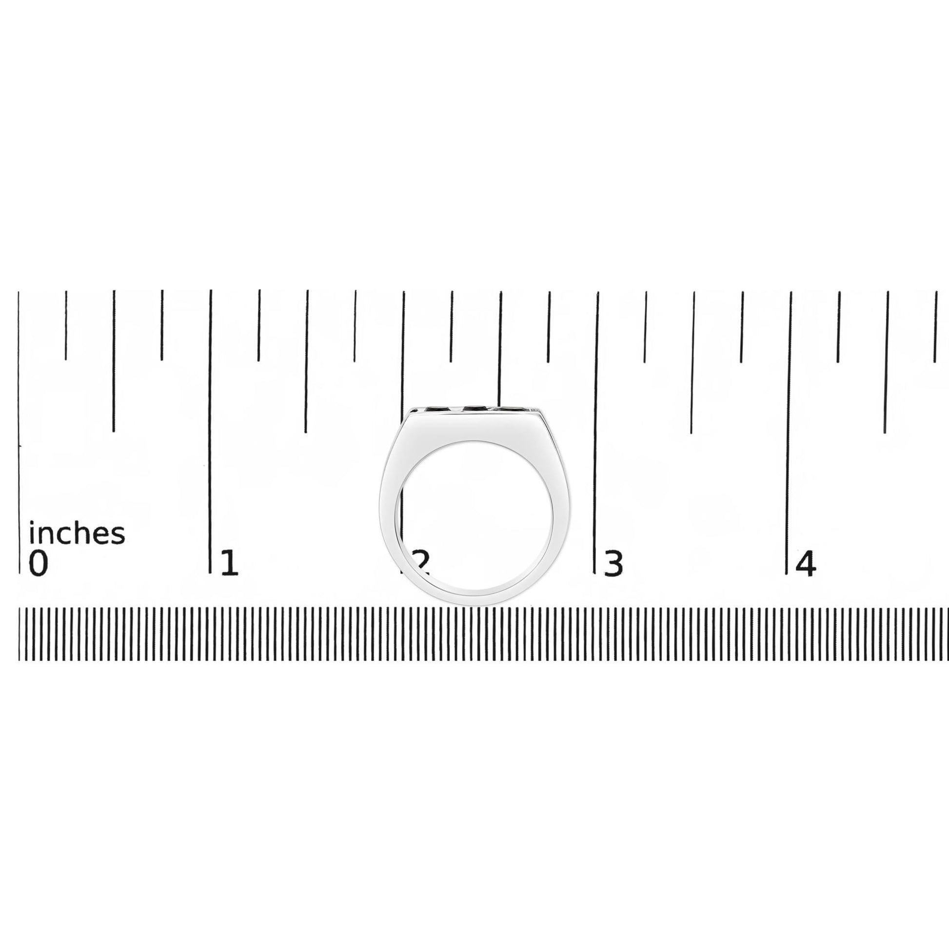 Ring in yellow, white, and black metal colors with three round black gemstones in a channel setting, shown on a measurement scale from the side angle.
