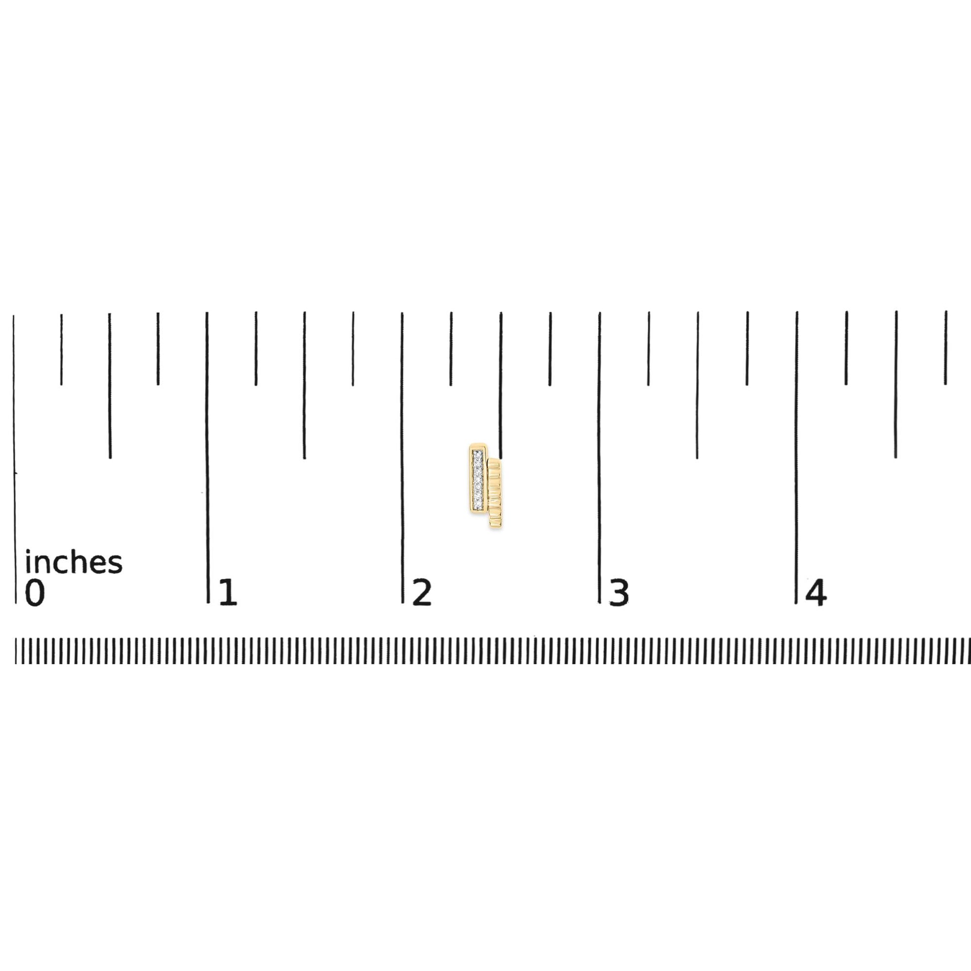 Close-up of a pair of yellow metal earrings with a row of small white round gemstones in a pave setting, shown on a ruler scale from a top angle.