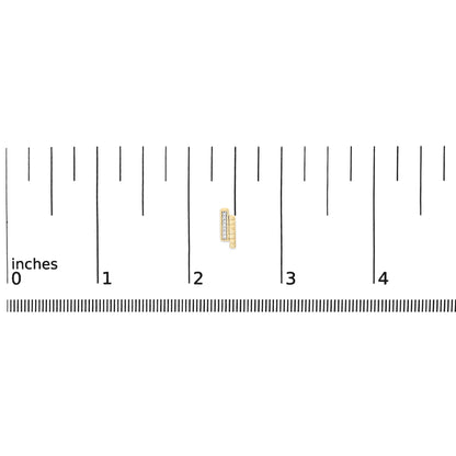 Close-up of a pair of yellow metal earrings with a row of small white round gemstones in a pave setting, shown on a ruler scale from a top angle.