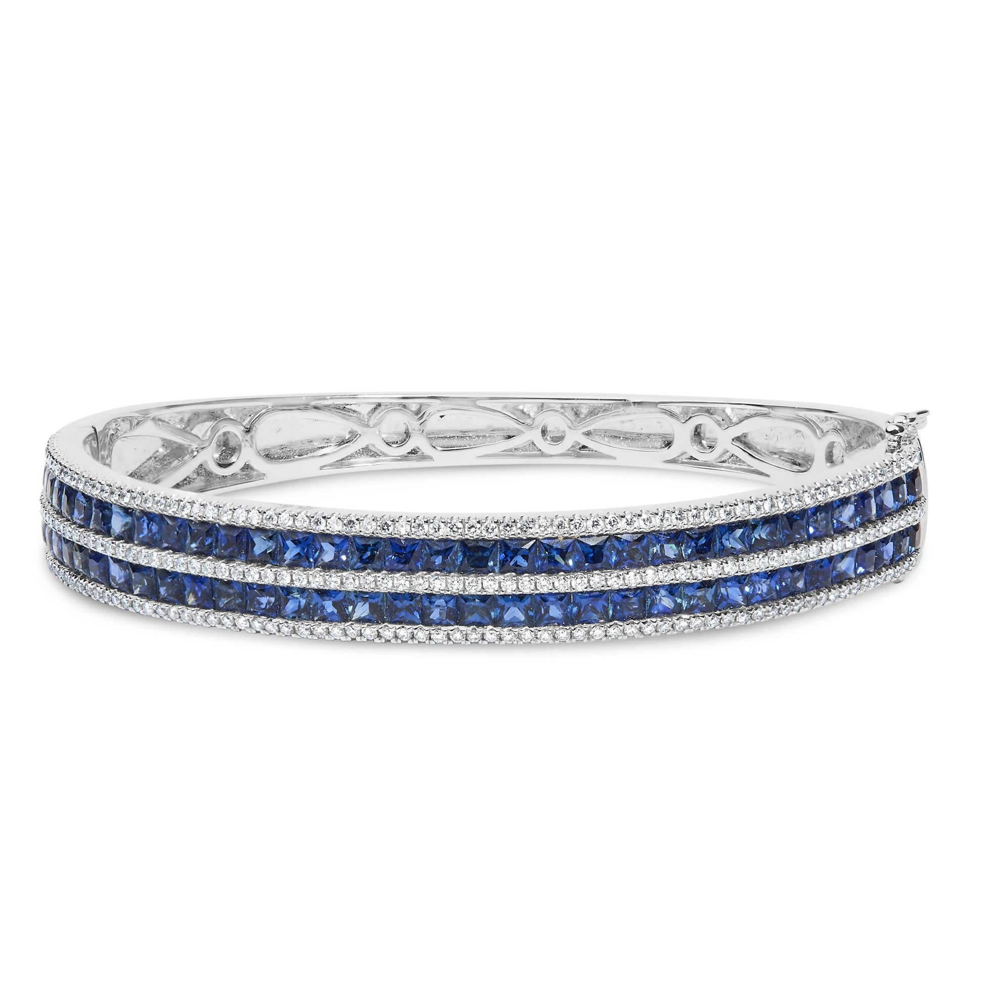 White metal bracelet with three rows of blue square-shaped gemstones channel set, separated by rows of small round white gemstones in four-prong settings, shown from a slightly angled front view.