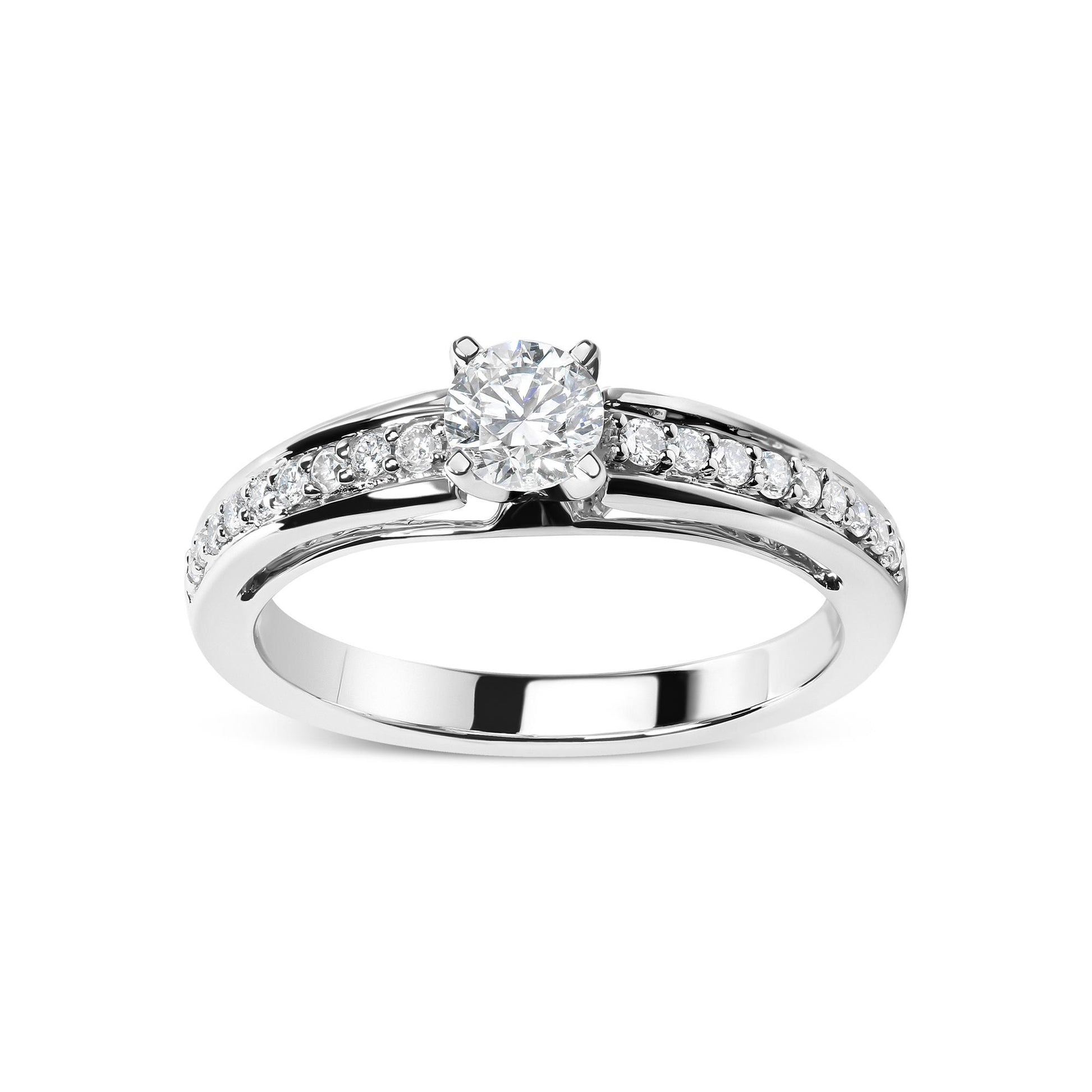 Front angle of a white metal ring featuring one round white gemstone in a four-prong setting and multiple smaller round white gemstones in shared prong settings along the band.