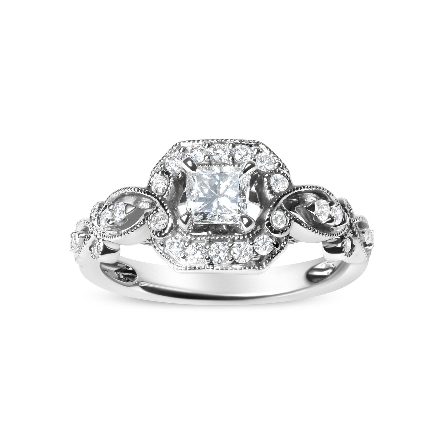 Front angle of white metal ring featuring a princess shape gemstone in a four-prong setting surrounded by round gemstones in a shared prong setting along the band.