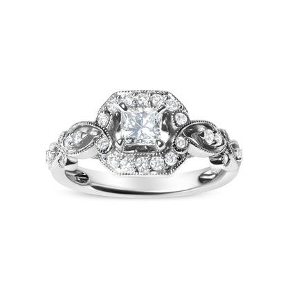 Front angle of white metal ring featuring a princess shape gemstone in a four-prong setting surrounded by round gemstones in a shared prong setting along the band.