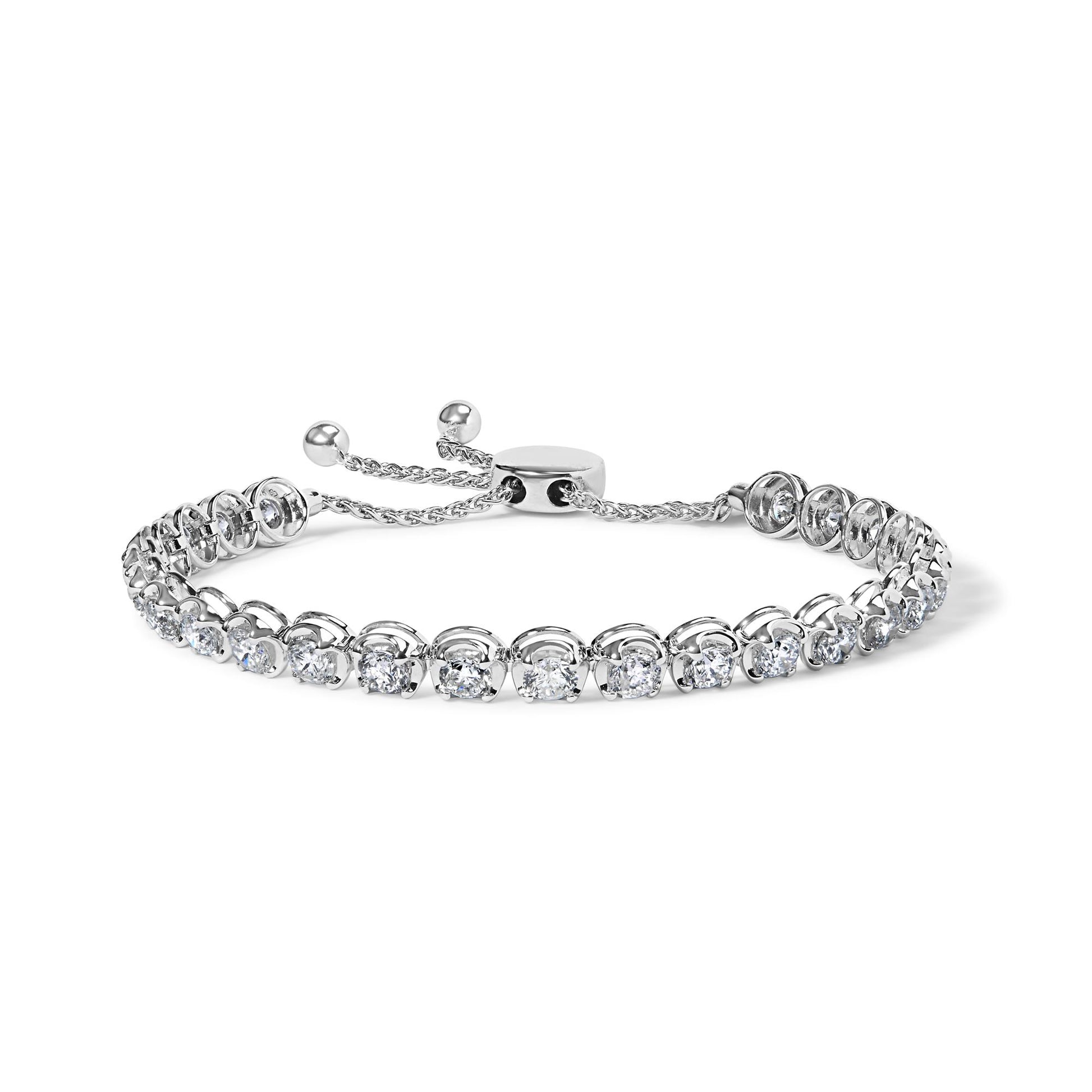 White metal bracelet with round white gemstones in 4-prong settings, shown in a close-up front angle.