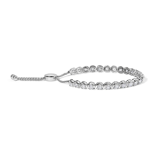 White metal bracelet with round white gemstones in 4-prong settings shown from a side angle.