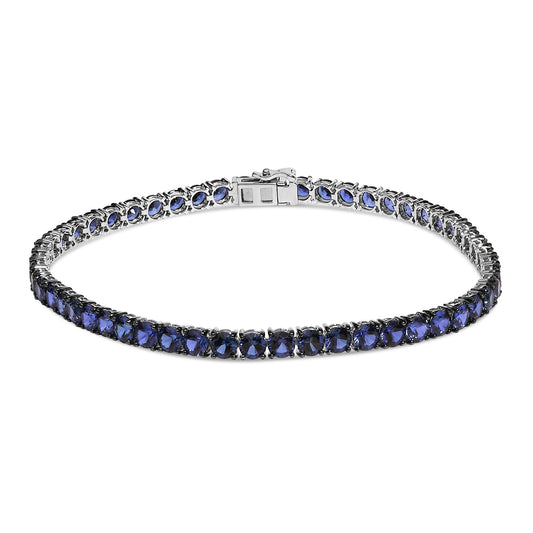 White metal bracelet with round blue gemstones set in 4-prong settings, shown from a front angle on a white background.