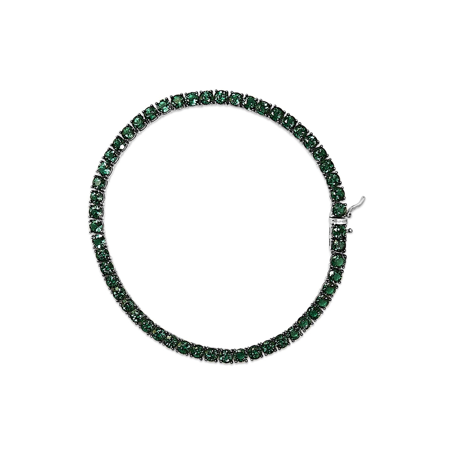 Top-down view of a white bracelet set with round green gemstones in a continuous line with a clasp visible.