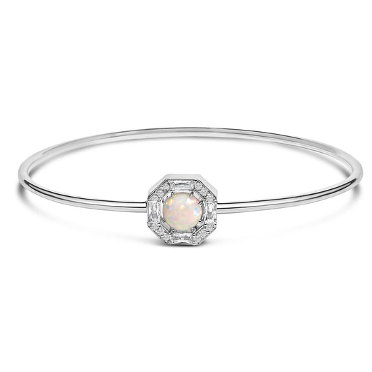 White metal bracelet with a thin circular band, centered with a round white opal gemstone surrounded by white round and baguette-shaped gemstones in prong settings, shown in a front-facing view on a white background.