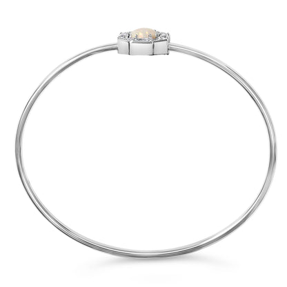 White metal bracelet shown from the front on a white background, featuring a central round white opal gemstone surrounded by round and baguette white gemstones in prong settings.