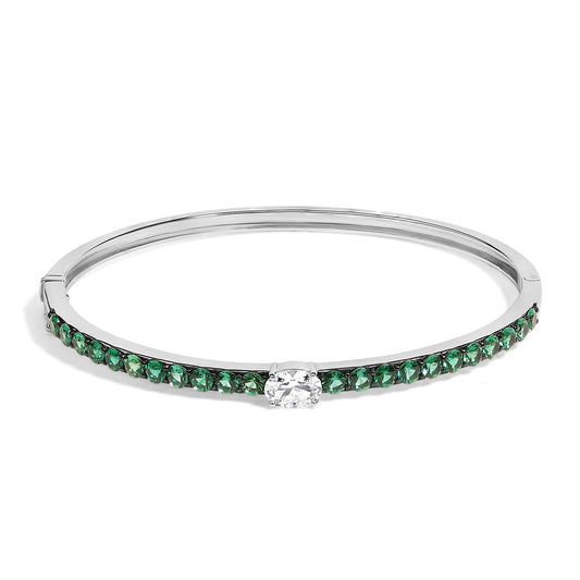 Bracelet with a white metal band, featuring a row of round green gemstones along the front and a single oval white gemstone center-set, shown from a front angle.