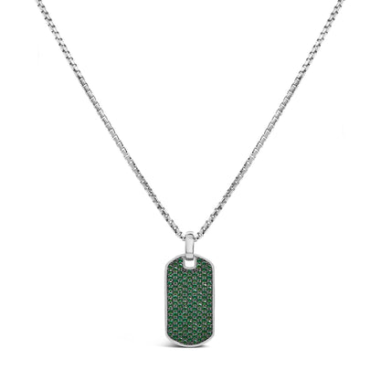 Front-facing shot of a white metal rectangular pendant necklace with rounded edges, fully paved with small round green gemstones in a shared prong setting, hanging on a white metal chain.