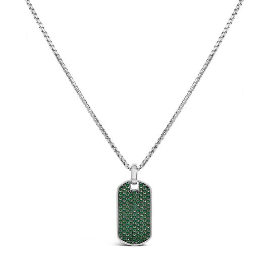Front-facing shot of a white metal rectangular pendant necklace with rounded edges, fully paved with small round green gemstones in a shared prong setting, hanging on a white metal chain.