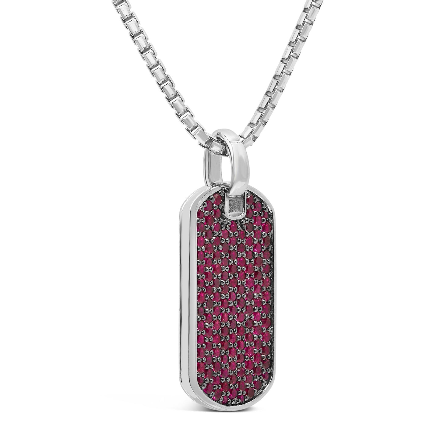 Close-up front angle of a white necklace with a rectangular pendant featuring multiple small round red gemstones in a shared prong setting.