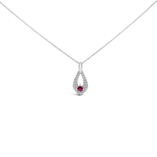 Front view of a white metal necklace with a teardrop-shaped pendant featuring a square red gemstone at the center surrounded by small round white gemstones, all set in prongs.