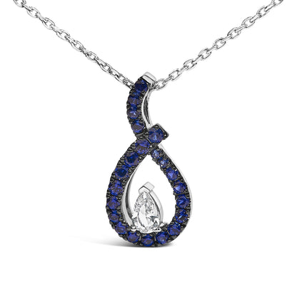 Close-up front view of a white metal necklace pendant with an open teardrop shape, featuring a pear-shaped white gemstone at the center surrounded by round blue gemstones in a prong setting.