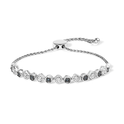 White metal bracelet with alternating round white and blue gemstones set in miracle settings, shown from a front angle.