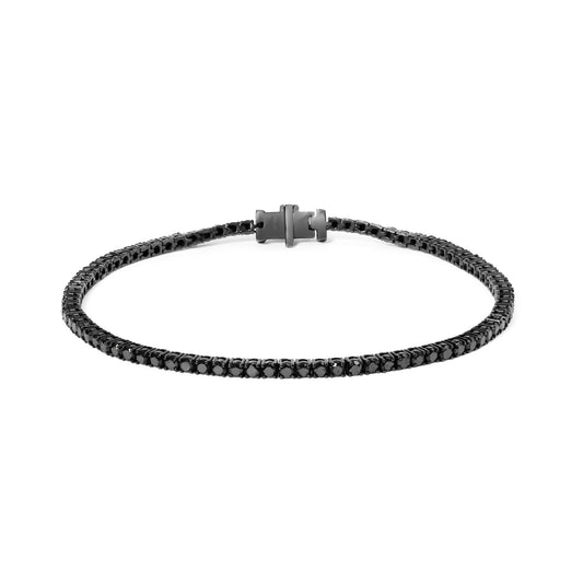 Close-up front angle of a white metal bracelet with round black gemstones set in four-prong and shared prong settings, laid flat with clasp visible.