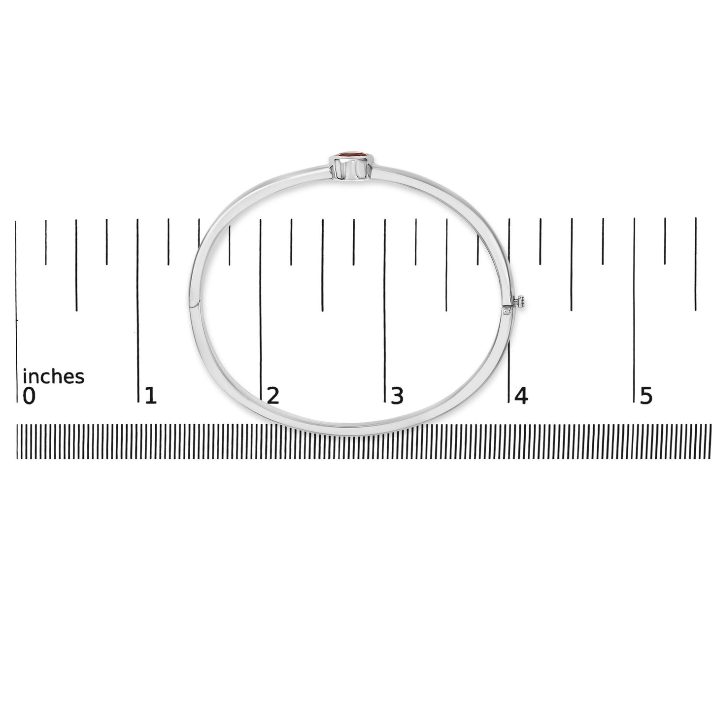 White bracelet with a single round red gemstone in a bezel setting, shown flat on a scale from a top-down angle.