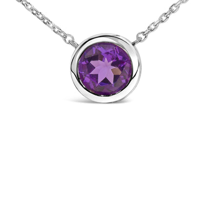 Close-up front angle of a white metal necklace with a round purple gemstone in a bezel setting.