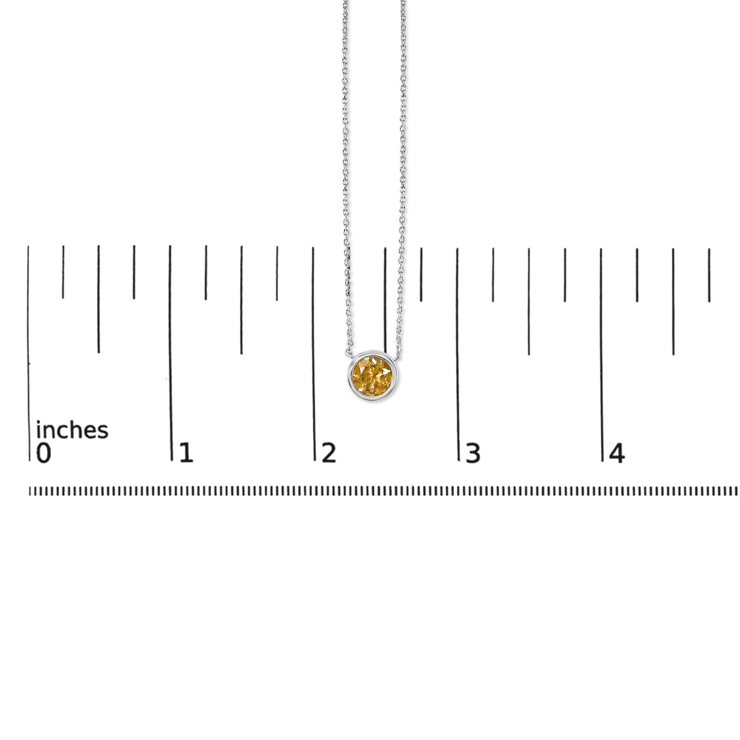 Close-up front view of a white metal necklace with a round yellow gemstone in a bezel setting, shown on a scale.